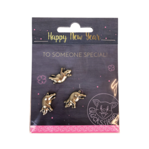 Goldenes Minischweinchen in Glücksverpackung