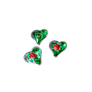 Glückssymbol auf grünem Herz sort.