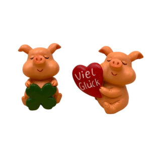 sitzendes Schweinchen mit Klee oder Herz sort.
